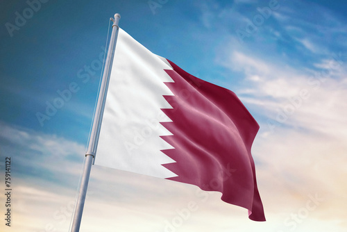 Waving flag of Qatar in blue sky. Qatar flag for independence day. The symbol of the state on wavy fabric. photo