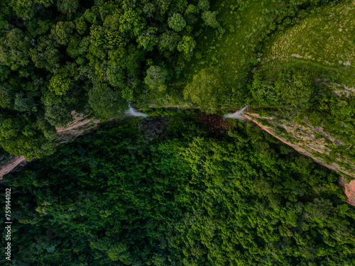 Aerial top down of waterfall in forest at Chapada dos Guimar  es National Park in Mato Grosso