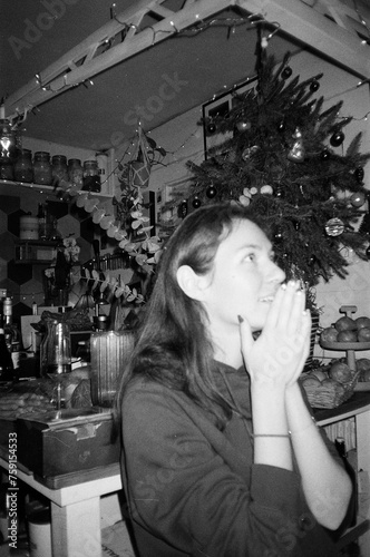 a candid moment a desire under a Christmas tree