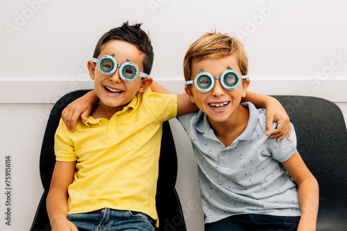 Cheerful kids in ophthalmic glasses photo