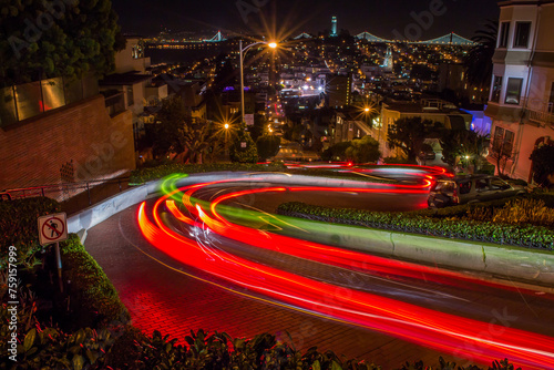 Light trails of a car down a windy street. photo