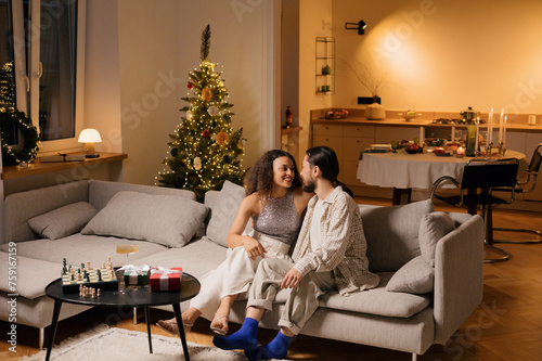 Cozy Holiday Love: Young Couple's Romantic Date photo