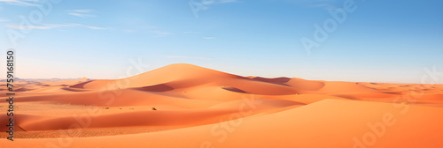 Solitude Personified: A Sweeping View of Endless Sand Dunes under a Deep Blue Sky
