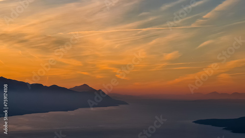 Scenic sunrise view from top of mount Kula in Omis, Dinara mountains, Split-Dalmatia, Croatia, Europe. Majestic coastline of Makarska Riviera, Adriatic Sea in Balkans in summer. Biokovo mountain range