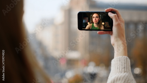 Urban girl talking video call closeup. Smiling girl chat in smartphone screen