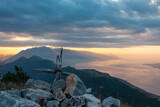 Wooden summit cross on top of mount Kula near Omis, Dinara mountains, Split-Dalmatia, Croatia, Europe. Majestic coastline Makarska Riviera, Adriatic Sea in Balkans in summer. Biokovo mountain range