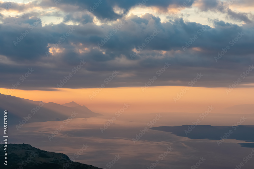 Scenic view from on top of mount Kula near Omis, Dinara mountains, Split-Dalmatia, Croatia, Europe. Majestic coastline of Makarska Riviera, Adriatic Sea in Balkans in summer. Biokovo mountain range