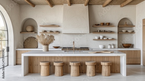 a kitchen with a white counter top surrounded by wooden shelves and shelves filled with pots, bowls, and vases. photo