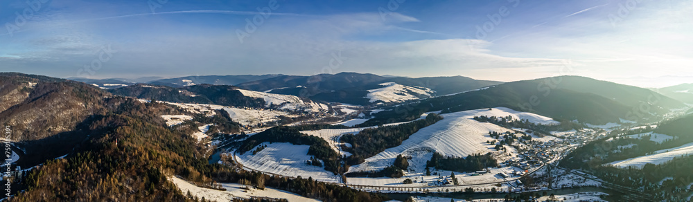 Panorama aerial view of the Poprad Landscape Park on the Poprad River in Beskid Sadecki on a sunny,winter day.