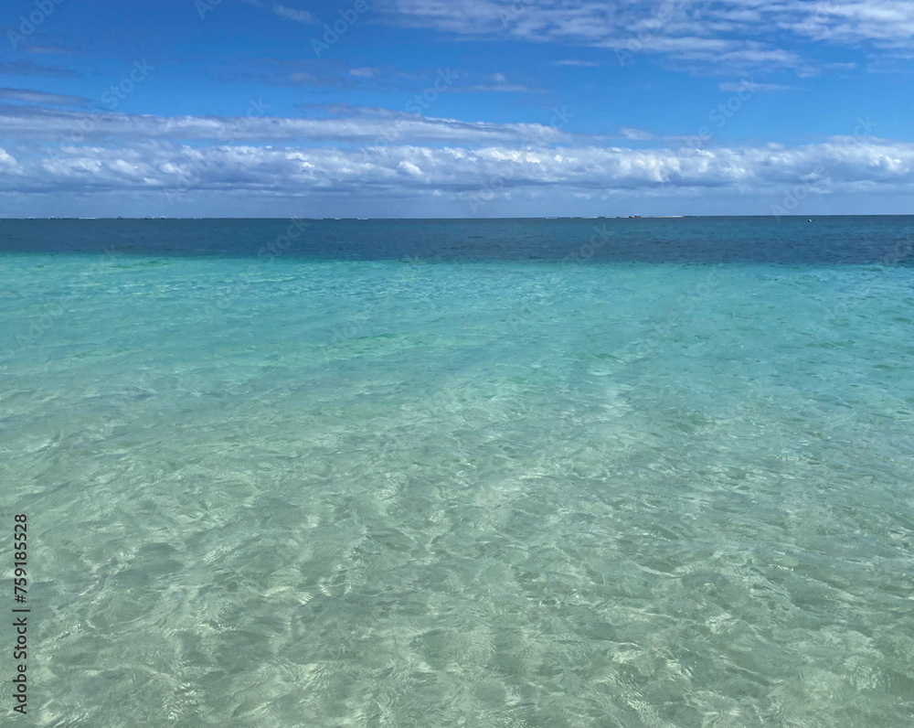 Close up shot of the crystal clear blue waters of the Caribbean Sea on a sunny day. Close up shot of the crystal clear blue waters of the Caribbean Sea on a sunny day.