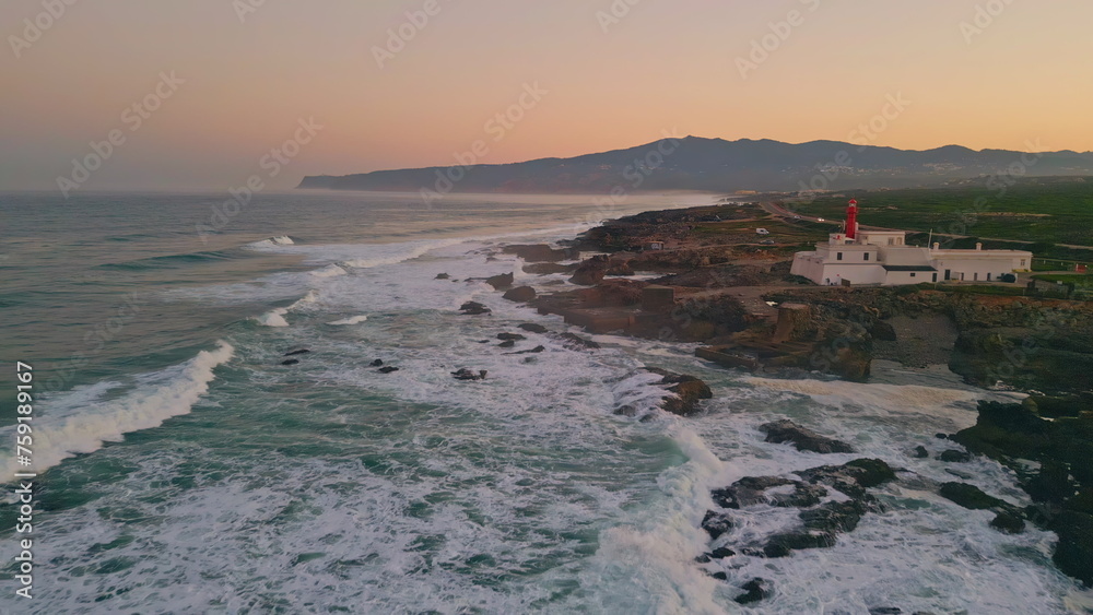 Drone beautiful evening seascape with stormy ocean waves crashing of rocky coast