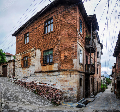 Houses with ancient architecture still in use in the mountain town of Vevcani, Macedonia. Famous for the carnival. photo