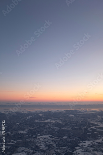 Orange sunset on a blue sky on a snowy winter lapland landscape in Rovaniemi, Finland