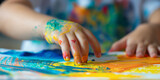 Colorful Finger Painting Activity by a Child Exploring Artistic Expression