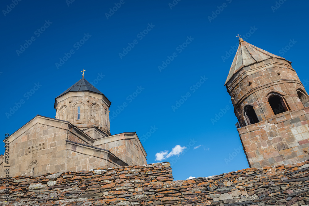 Tsminda Sameba - Trinity Church with bell tower in Gergeti village near Stepantsminda, Georgia