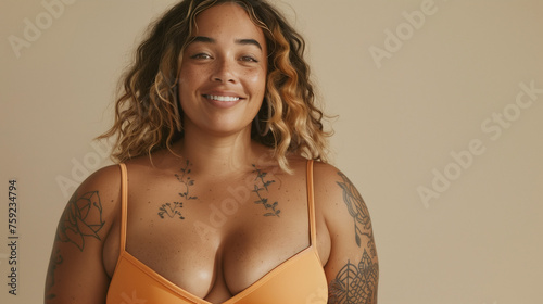 Body positive woman in underwear lingerie. Young woman happy smiling with tattoo for studio shot. Natural beauty and women body positive