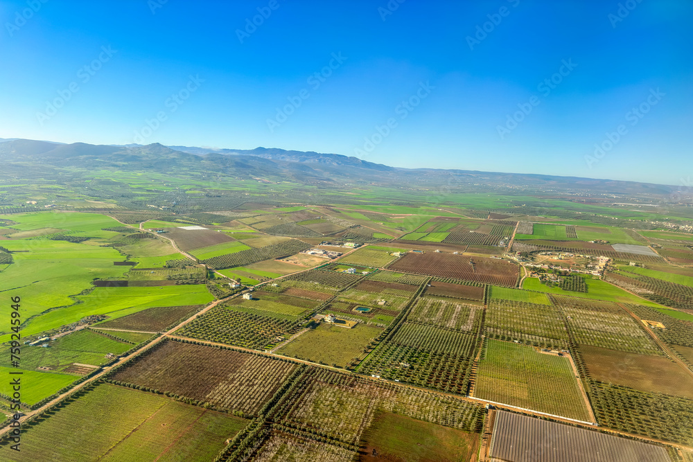 Aerial view from a plane's window over a rural area in Morocco