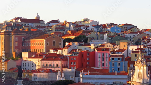 Lisbon sunset colored houses tourism Portugal orange light rooftops neighborhood