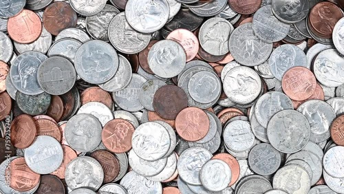 4K HD video panning down dirty American coins laying on a flat surface. Quarters, dimes, nickels and pennies.
 photo