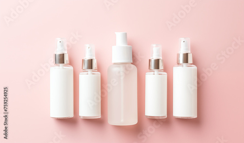 a collection of skincare and cosmetic bottles showcased against a pink background, illustrating the beauty concept.