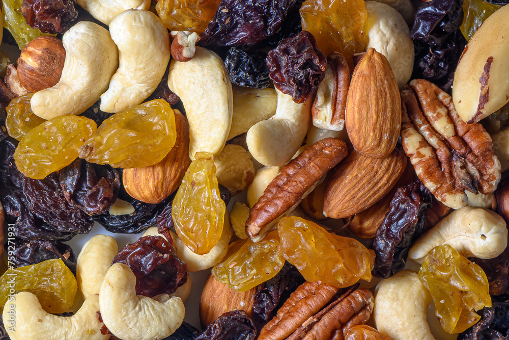 background with a cashew, hazelnuts, raisins and peanuts. Mixed nuts and raisins texture.9 background with a cashew, hazelnuts, raisins and peanuts. Mixed nuts and raisins texture.9
