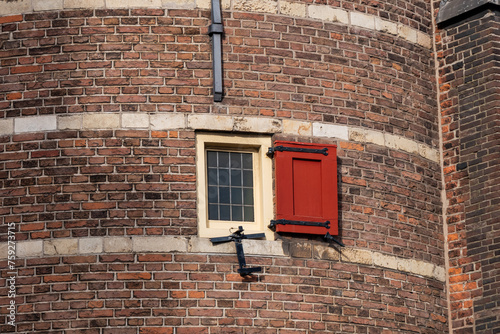 Fragment of Amsterdam Mint Tower (or Munttoren, 1620) at Muntplein square near flower market. Munttoren was originally part of gate in Amsterdam's medieval city wall. Amsterdam, the Netherlands. photo