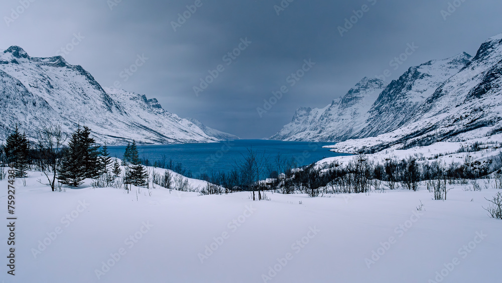 Blue water lake surrounded by the fjords in Tromso, Norway