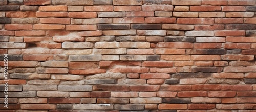 A detailed closeup of a brown brick wall showcasing the intricate brickwork and composite material used in the building construction process