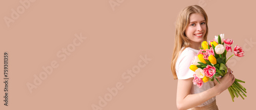 Happy young woman with bouq...