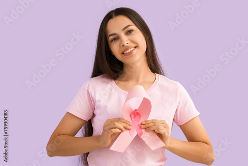 Young woman with pink ribbo...
