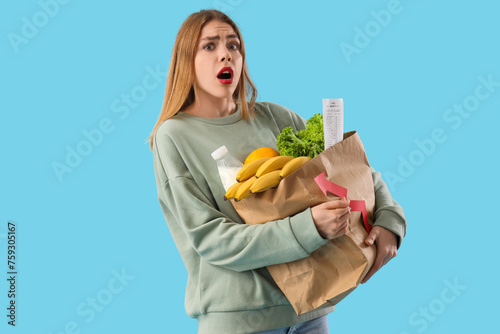 Shocked young woman with ar...