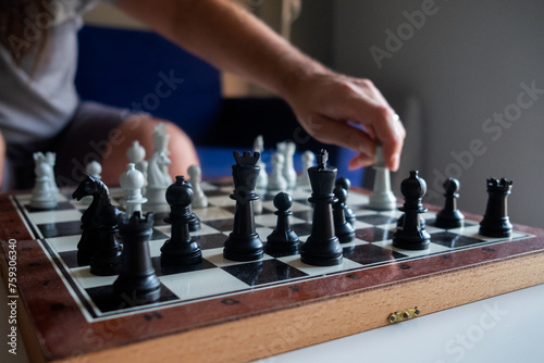 Male playing chess photo