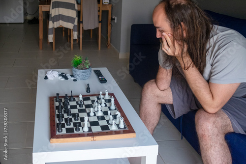 Female playing chess photo