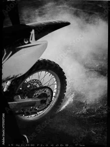 Speed Demon: Close-Up of Motocross Wheel in Rapid Motion photo