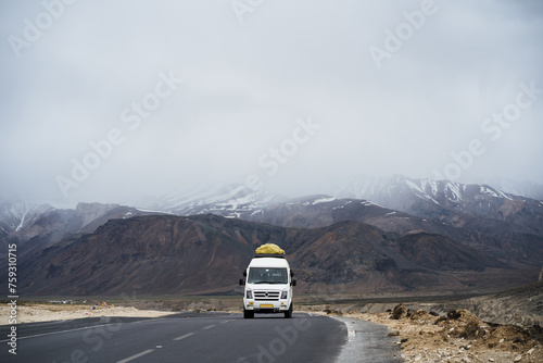 Van on the fog road in Ladakh.