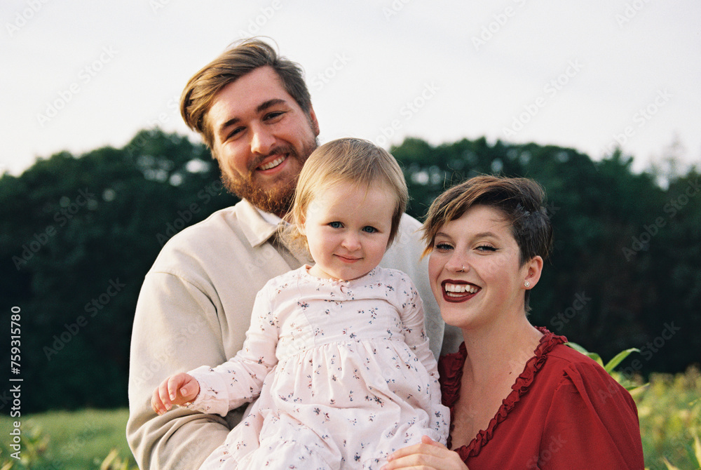 happy family outdoors in nature on a september evening happy family outdoors in nature on a september evening
