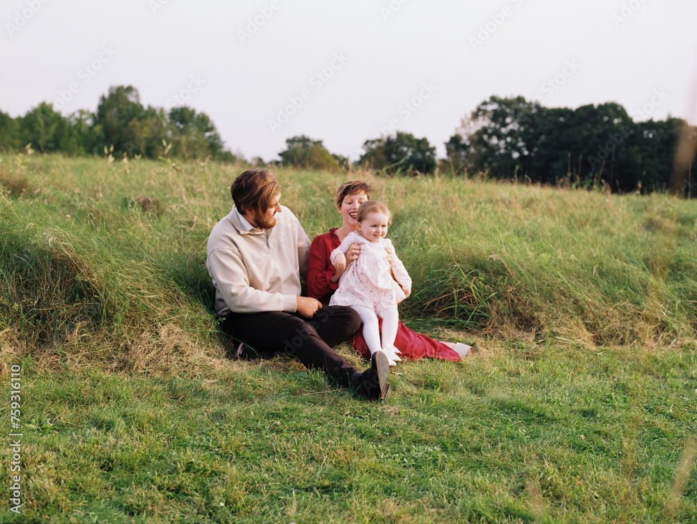 happy family outdoors in nature on a september evening happy family outdoors in nature on a september evening