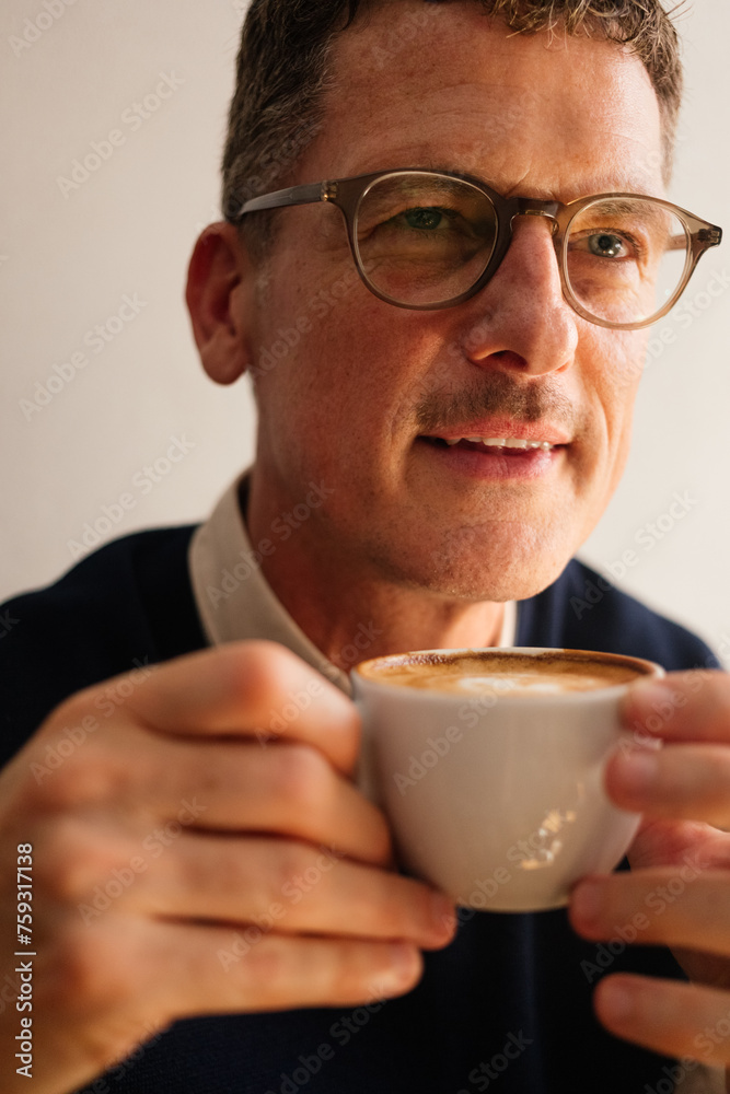 Man holding cup of coffee Man holding cup of coffee