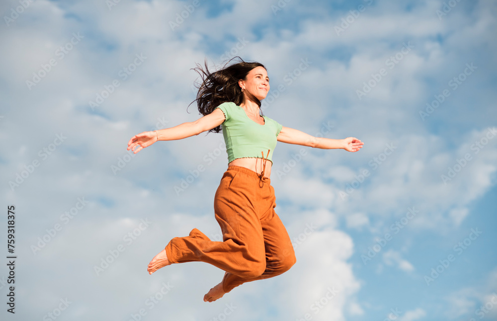 Woman in the air feeling pure happiness Woman in the air feeling pure happiness
