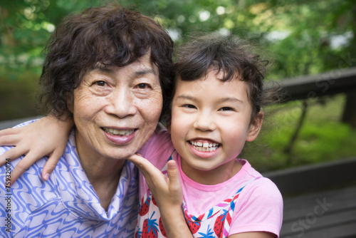 Happy Aisan grandmother and grandchild: tho generations photo