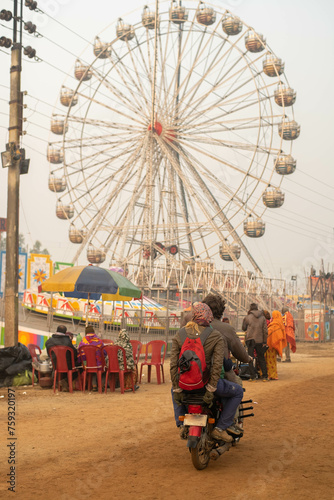 Exciting celebration at colorful outdoor amusement park photo