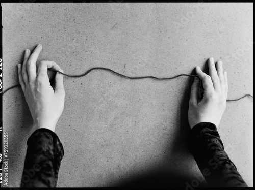 thread in the hands of a young woman, close-up photo