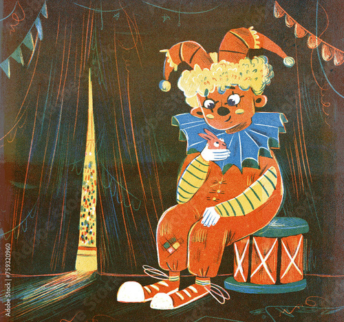 The clown is holding a rabbit