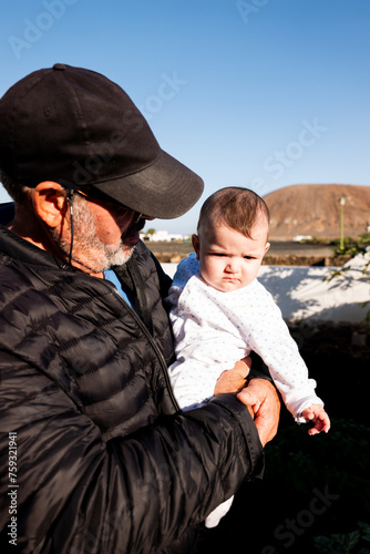 Grandfather and Granddaughter: Joyful Moments photo