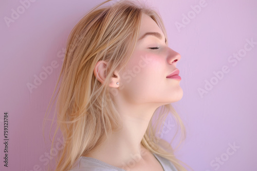 A close up of a woman 's face with her eyes closed