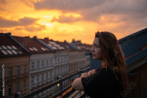 Woman Admires After-Rain Sunset photo