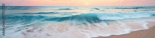 Calm and paradisiacal Caribbean beach during sunset. Sunny sea shore with foamy water and waves. Beautiful and serene beach in soft pastel pink and turquoise tones.  Summertime and marine banner. © cabado