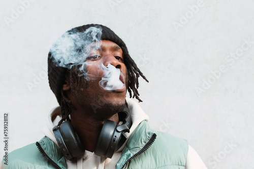 Black man smoking electronic cigarette