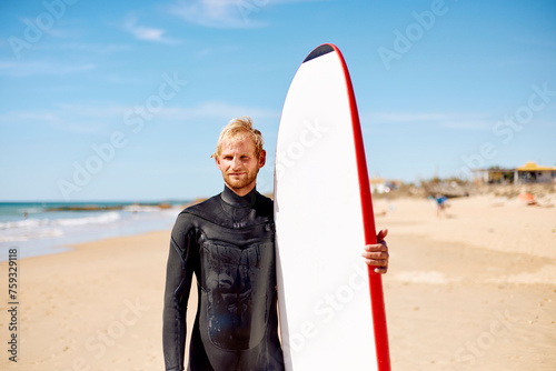 Surfer on the sandy shore