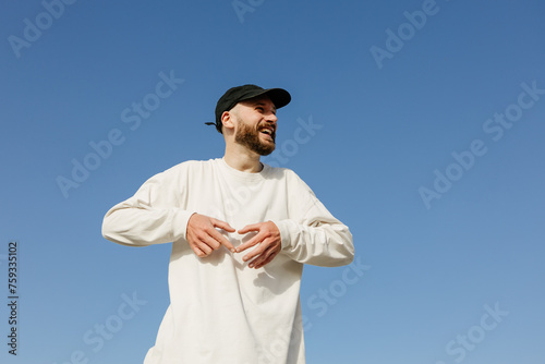 Portrait of a man against the sky